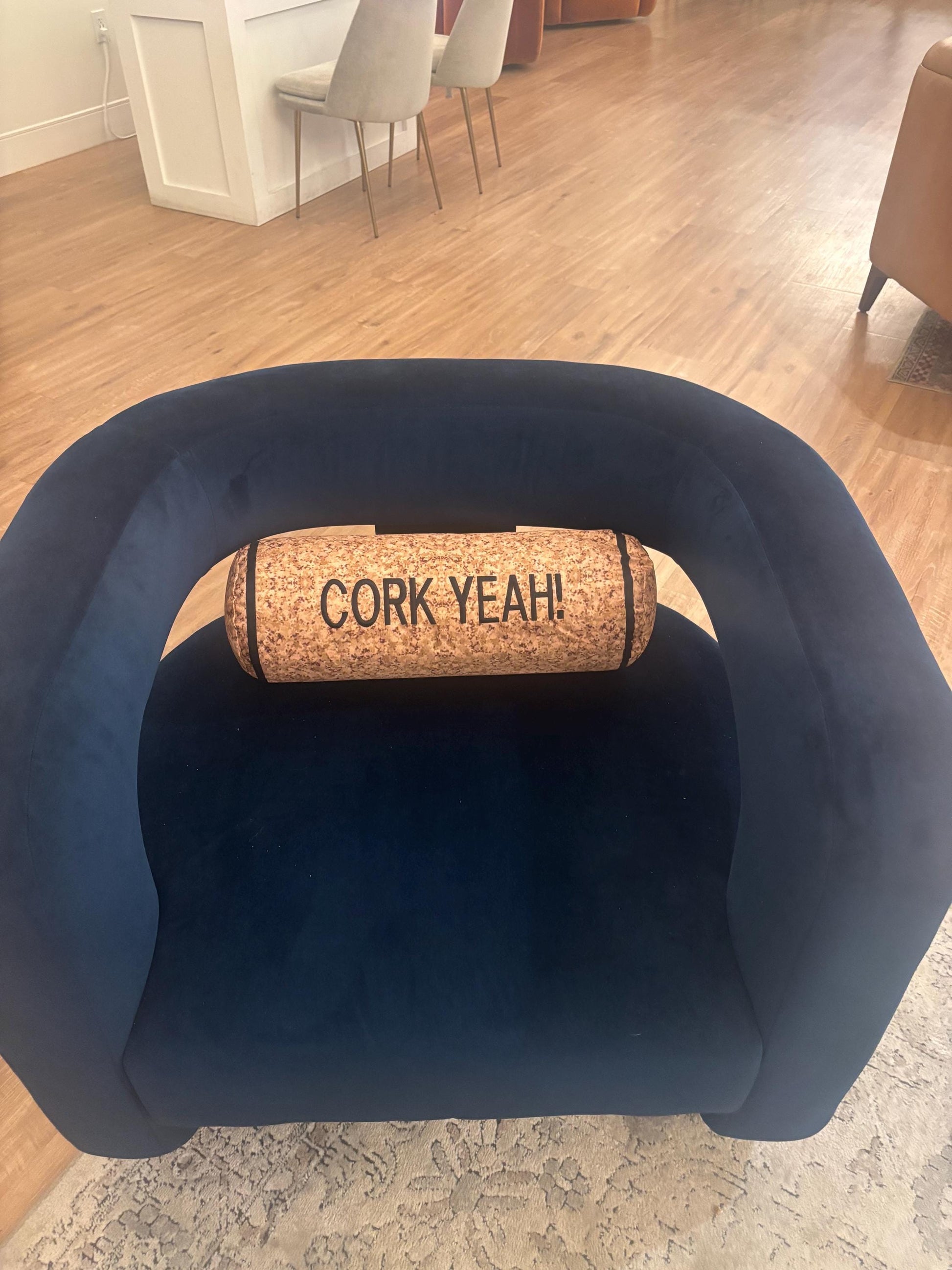 CORK YEAH embroidered on a wine cork shape pillow. Funny winelover gift. Will get a few laughs.