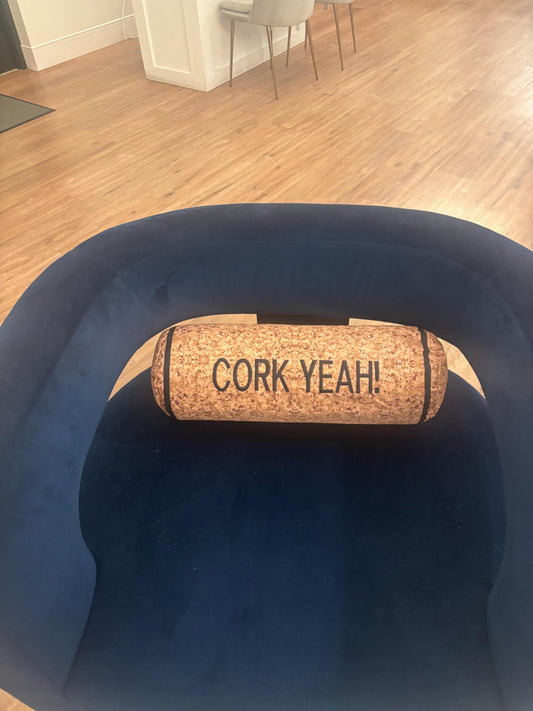 CORK YEAH embroidered on a wine cork shape pillow. Funny winelover gift. Will get a few laughs.