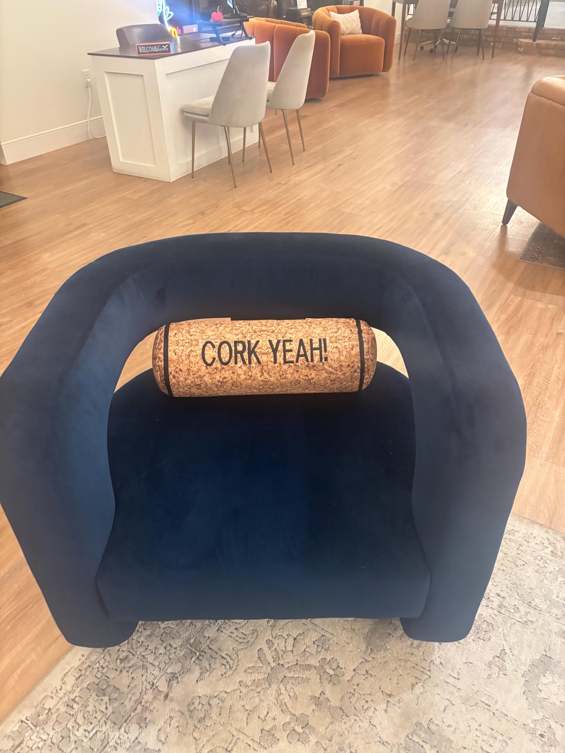 CORK YEAH embroidered on a wine cork shape pillow. Funny winelover gift. Will get a few laughs.