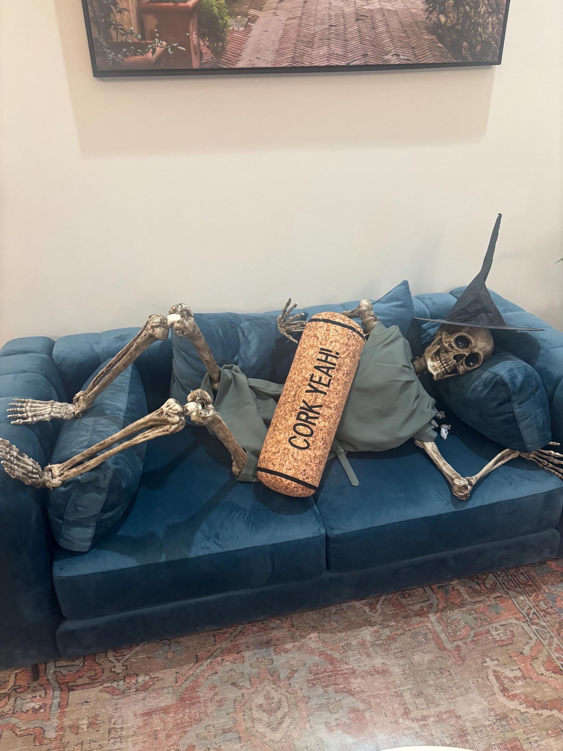 CORK YEAH embroidered on a wine cork shape pillow. Funny winelover gift. Will get a few laughs.